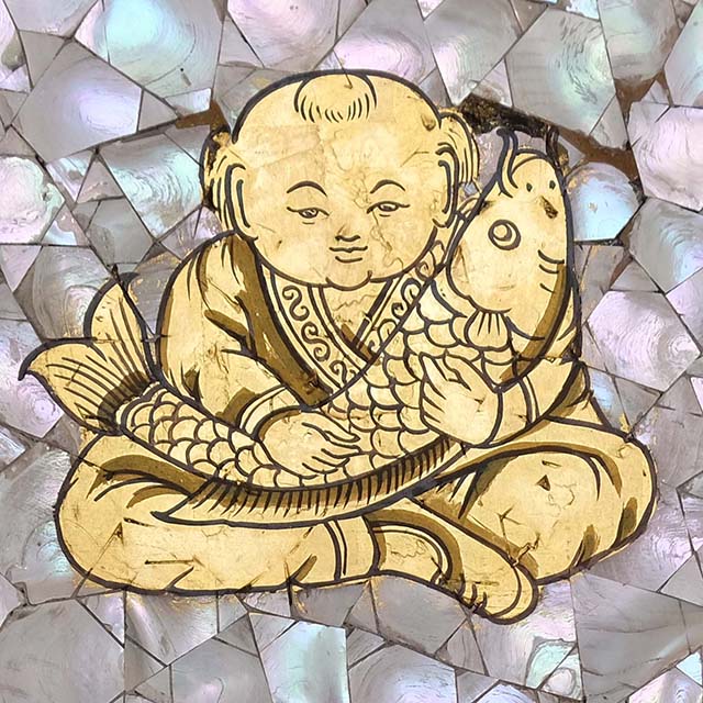 Thai Motif: lucky boy and fish